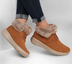 Laid-back style and cozy comfort combine in Skechers On-the-GO Joy - Plush Dreams. This slip-on cold-weather boot features a Scotchgard® treated suede upper with a faux-fur collar  Skechers Air-Cooled Goga Mat insole and lightweight 5GEN® cushioned midsole. Skechers Women Ankle Boots, Sketchers Shoes Boots, Snicker Bootsa For Women Shop, Skechers Snow Boots, Skechers Boots Woman Winter Discontinued, Skechers Shoes Women Slip On, Skechers Women Boots, Preppy Winter Shoes, Winter Boots Women Fashion