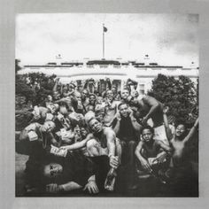 a group of people posing for a photo in front of the white house with their arms up