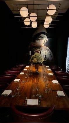 a long wooden table topped with lots of glasses