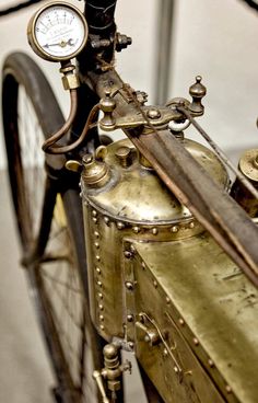 an old fashioned bicycle with gauges attached to it