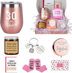 a pink gift box with personalized items and tags