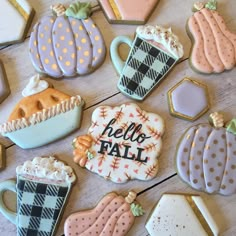 decorated cookies with the words hello fall and coffee mugs on them are laid out next to each other