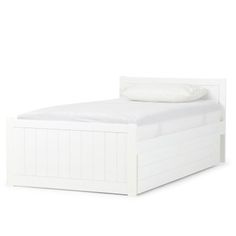 a white bed with no sheets on it