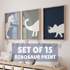 three dinosaur silhouettes are hung on the wall above a bench with pillows and pillow covers