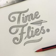 a pencil drawing the words time flies on a piece of paper