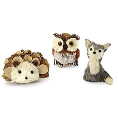 three small figurines of different animals on a white background, one has an owl and the other is a hedgehog