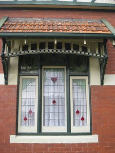 a red brick building with stained glass windows