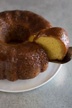 a bundt cake on a white plate with a bite taken out of the top