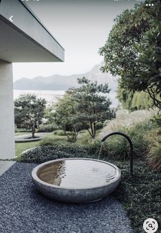 an outdoor bathtub in the middle of a garden