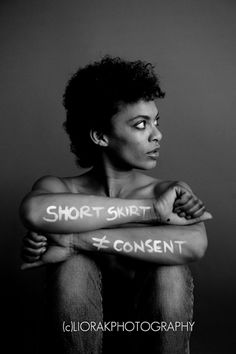 a black and white photo of a woman with words on her arm that read short spirit, content