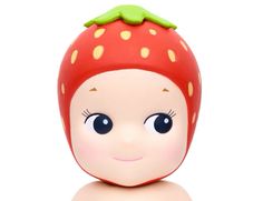 a close up of a toy with a strawberry on it's head and eyes