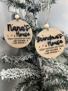 two wooden ornaments hanging from a tree with words on them that read nana's house and grandma's house