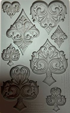 a cookie sheet with different designs on it