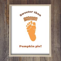 a poster with the words sweeter than pumpkin pie on it and an image of a baby's foot