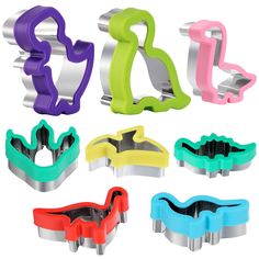 six different colored cookie cutters sitting next to each other