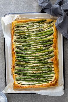 a casserole dish with asparagus and cheese