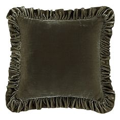 a dark green pillow with ruffled edges