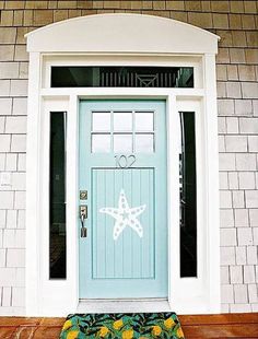 a blue front door on a brick building