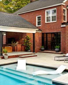 a house with a swimming pool and patio area