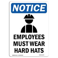 a sign that says notice employees must wear hard hats