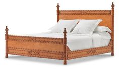 a wooden bed with white linens and pillows on it's headboard, against a white background