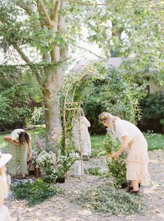 two women are working in the garden together