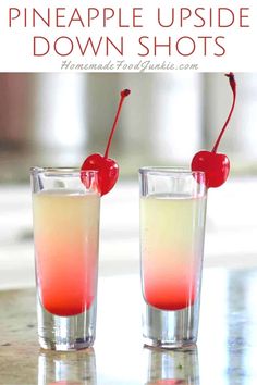 two glasses filled with liquid and topped with a cherry