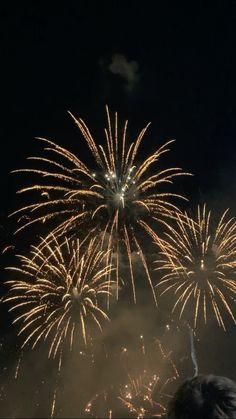 fireworks are lit up in the night sky