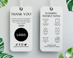 two tags with the words wash you and instructions for washing your clothes on them next to some green leaves