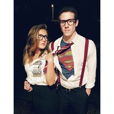 a man and woman dressed up as superman and the girl is wearing a dress shirt