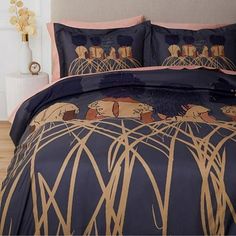 an image of a bedroom setting with blue and gold bed linens on the bed