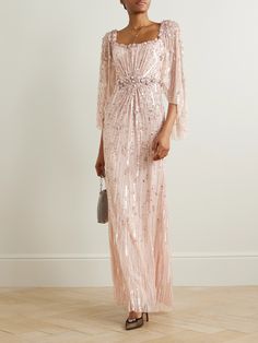 You'll shimmer from head to toe in Jenny Packham's 'Bright Star' gown. Designed with floaty, cape-effect sleeves, it's crafted from tulle traced with scores of dainty crystals and sequins that fall like shooting stars along its length. Match your blush to the 'Sugar' pink shade. Embellished Prom Dress With Cape Sleeves, Luxury Sequin Dress With Cape Sleeves, Luxury Sequined Dresses With Cape Sleeves, Formal Embellished Gown With Cape Sleeves, Luxury Embellished Gown With Cape Sleeves, Glamorous Embellished Gown With Cape Sleeves, Jenny Packham Dresses, Flat Dress Shoes, Dress Flats