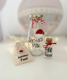 a santa's milk bottle and bag sitting on a table