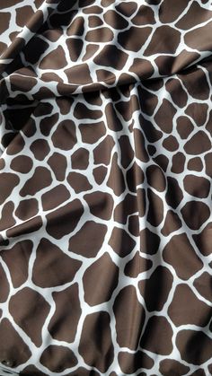 the giraffe print fabric is brown and white