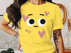 Express with Emoji: Yellow Shirt Collection 😀 Elevate your wardrobe with our emoji-inspired yellow shirts, adding a dash of fun and expression to your style. Why Choose Our Emoji Yellow Shirts? ✨ Support a Small Business: Your purchase directly supports our creative journey, helping us bring more cheerful designs to life. 😃 Express Yourself: Wear the iconic emoji face proudly and let your emotions shine through your fashion. 🌟 Premium Quality: Crafted with care, our shirts offer comfort and vibrant style, perfect for a pop of color. 🎁 Perfect Gift: Share the joy of expression with a friend, and gift them a shirt that's as bright as their smile. Join us in celebrating the art of expression. Shop now and add a touch of cheerfulness to your attire! 𝐏𝐑𝐎𝐂𝐄𝐒𝐒𝐈𝐍𝐆 𝐓𝐈𝐌𝐄 𝗔𝗡𝗗 𝐒? Funny Yellow Graphic Print Top, Funny Yellow Crew Neck Top, Funny Yellow Top With Letter Print, Funny Yellow Tops With Funny Print, Funny Yellow Tops With Letter Print, Yellow Tops With Funny Print, Fun Yellow Crew Neck Shirt, Yellow Crew Neck Top With Funny Text, Yellow Casual Tops With Funny Text