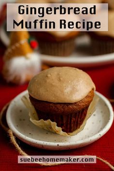 a muffin sitting on top of a white plate next to other muffins