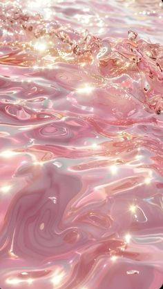 pink water with bubbles and sparkles in it