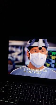 a man wearing a face mask is on a laptop screen with the caption it's a beautiful day to save lives