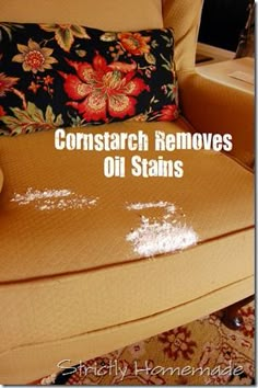 a chair that has some white stuff on it and the words cornstarch removes oil stains