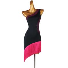 a mannequin wearing a black and pink dress with fringes on the skirt