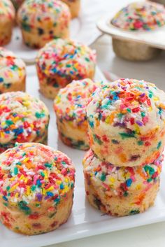 sprinkle covered muffins on a white plate