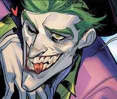 a close up of a joker with green hair