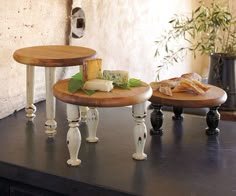 three tiered trays with cheese and bread on them