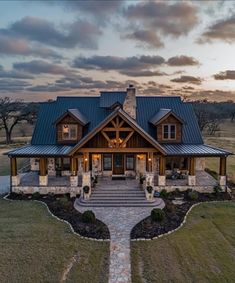 a large house with a stone walkway leading to it