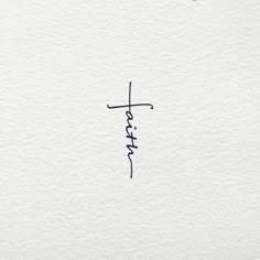 the word faith written in cursive ink on white paper