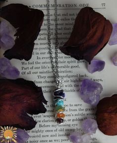 Small Chakra Pendant Hand wrapped, about 1.25" long, made with amethyst, lapis lazuli, turquoise, aventurine, citrine, carnelian, and garnet.  Chose from silver plated, gold plated, or copper.  Lobster Clasp Closure. ☽ ☾ A M E T H Y S T ☽ ☾ Balances the Crown Chakra.  Provides spiritual protection from psychic attacks and negative energy. ☽ ☾ L A P I S  L A Z U L I ☽ ☾ Balances the Third Eye Chakra. It is a stone for knowledge and intellectual ability. ☽ ☾ T U R Q U O I S E  ☽ ☾ Balances the Throat Chakra.  Helps aid in communication and provides protection. ☽ ☾ A V E N T U R I N E ☽ ☾ Balances the Heart Chakra.  Anti-Stress and Anti-Anxiety, known for good luck. ☽ ☾ C I T R I N E ☽ ☾ Balances the Solar Plexus Chakra.  Brings abundance , success, and good luck. ☽ ☾ C A R N E L I A N ☽ ☾ Ba Chakra Racine, Chakra Pendant, Chakra Necklace, Solar Plexus Chakra, Third Eye Chakra, Throat Chakra, Root Chakra, Crown Chakra, Hand Wrap