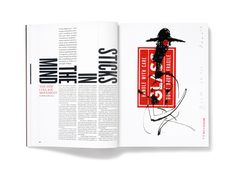 an open book with black and red illustrations