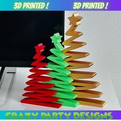 there is a christmas tree made out of paper on the computer screen and it says 3d printed