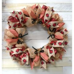 a burlock wreath with ladybugs on it