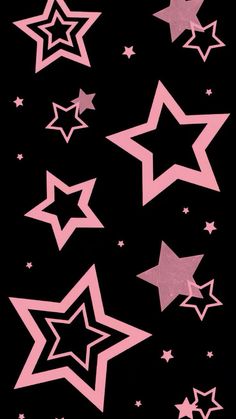 pink and black stars are flying in the air on a black background with white stars